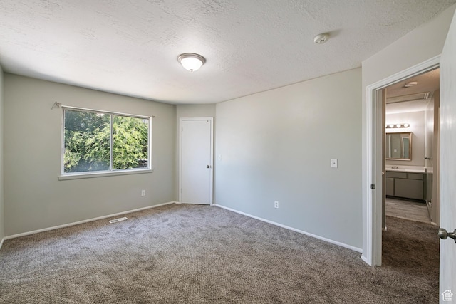 558 N Redwood Rd Unit 3, Salt Lake City, UT 84116 - carpeted spare room featuring a smoke detector and a textured ceiling