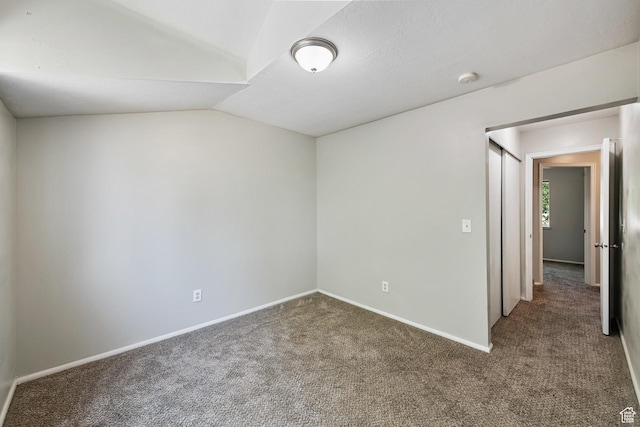 558 N Redwood Rd Unit 3, Salt Lake City, UT 84116 - spare room with carpet flooring, lofted ceiling, and a smoke detector