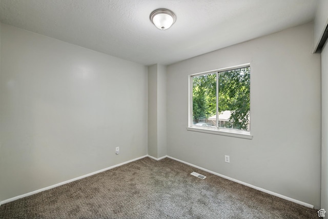 558 N Redwood Rd Unit 3, Salt Lake City, UT 84116 - carpeted empty room featuring baseboards