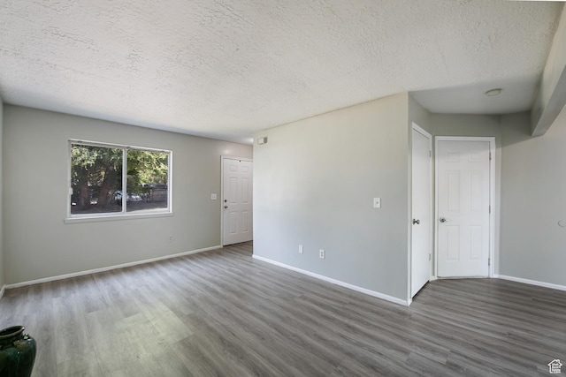 558 N Redwood Rd Unit 3, Salt Lake City, UT 84116 - empty room with a textured ceiling and wood finished floors