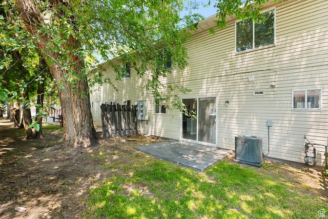 558 N Redwood Rd Unit 3, Salt Lake City, UT 84116 - rear view of property with a patio and a yard