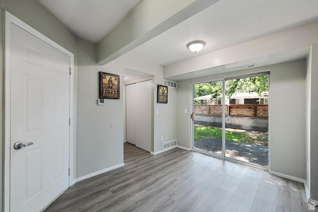 558 N Redwood Rd Unit 3, Salt Lake City, UT 84116 - unfurnished room featuring baseboards and wood finished floors