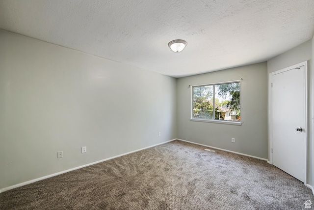 558 N Redwood Rd Unit 3, Salt Lake City, UT 84116 - carpeted empty room with a textured ceiling