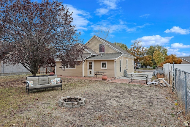 330 N 100 W, Brigham City, UT 84302 - back of house with an outdoor living space with a fire pit, a fenced backyard, and a patio