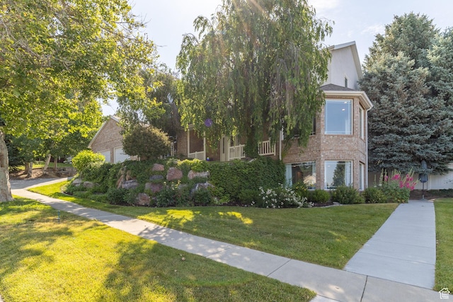 1320 E Canberra Dr, Lindon, UT 84042 - view of property hidden behind natural elements with a front yard and brick siding