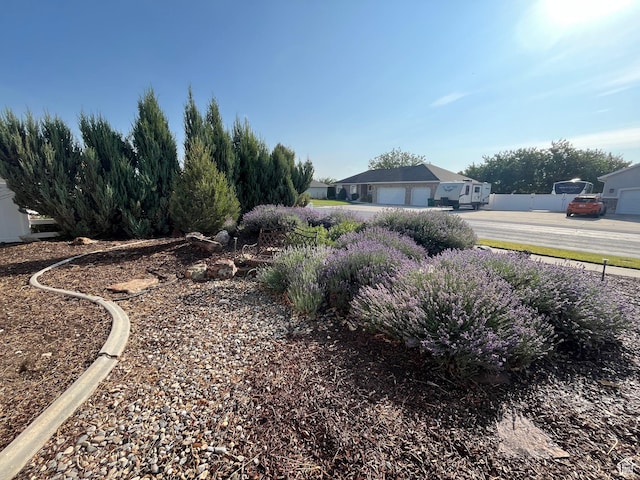 7886 S Abercrombie Ln, West Jordan, UT 84088 - view of yard featuring an attached garage