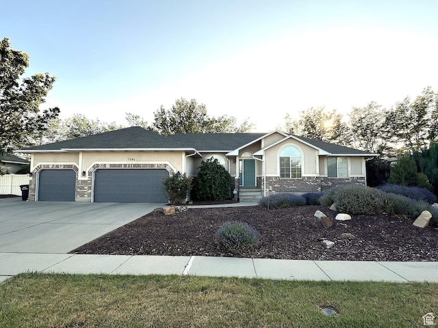 7886 S Abercrombie Ln, West Jordan, UT 84088 - ranch-style home featuring stone siding, a garage, concrete driveway, and stucco siding