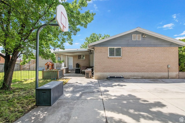 4663 S 2030 W, Taylorsville, UT 84129 - back of house with brick siding and a patio