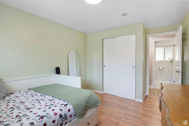4663 S 2030 W, Taylorsville, UT 84129 - bedroom with light wood-style flooring and a closet