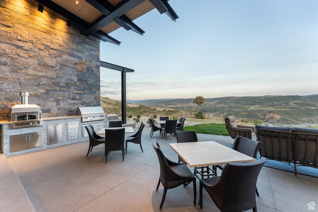 9156 N Sleeping Rock Cir, Kamas, UT 84036 - view of patio / terrace with outdoor dining space and an outdoor kitchen