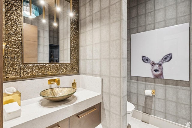9156 N Sleeping Rock Cir, Kamas, UT 84036 - bathroom with tile walls, vanity, and tasteful backsplash