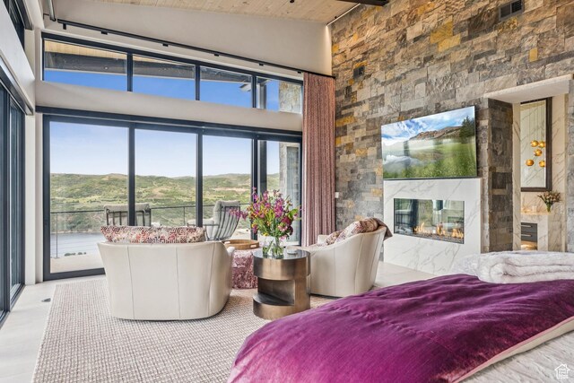 9156 N Sleeping Rock Cir, Kamas, UT 84036 - bedroom featuring a premium fireplace, wood ceiling, and high vaulted ceiling