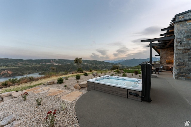9156 N Sleeping Rock Cir, Kamas, UT 84036 - view of swimming pool featuring a hot tub, a patio area, and a water and mountain view