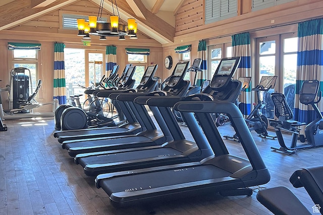 9156 N Sleeping Rock Cir, Kamas, UT 84036 - workout area featuring hardwood / wood-style flooring, wood walls, and a chandelier