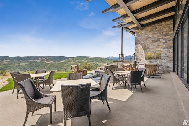 9156 N Sleeping Rock Cir, Kamas, UT 84036 - view of patio featuring outdoor dining space and a mountain view