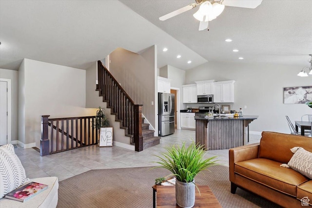 1592 E Maple Way S, Layton, UT 84040 - living room featuring ceiling fan, vaulted ceiling, recessed lighting, light tile patterned floors, and stairs