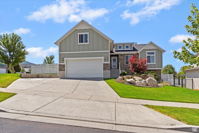 1592 E Maple Way S, Layton, UT 84040 - craftsman-style house featuring board and batten siding, concrete driveway, and an attached garage
