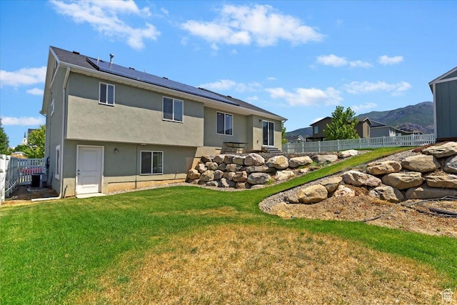 1592 E Maple Way S, Layton, UT 84040 - rear view of house with solar panels and stucco siding