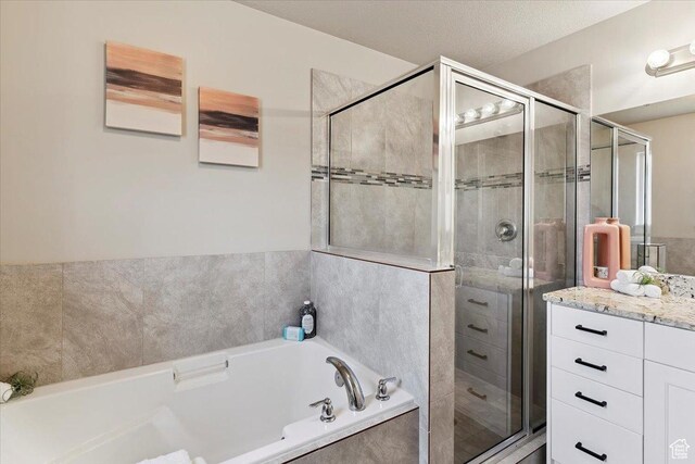 1592 E Maple Way S, Layton, UT 84040 - bathroom with a garden tub, a stall shower, and vanity