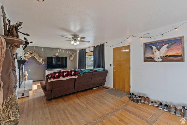 961 Hillview Rd, Brigham City, UT 84302 - living area with a ceiling fan, wood finished floors, and a textured ceiling