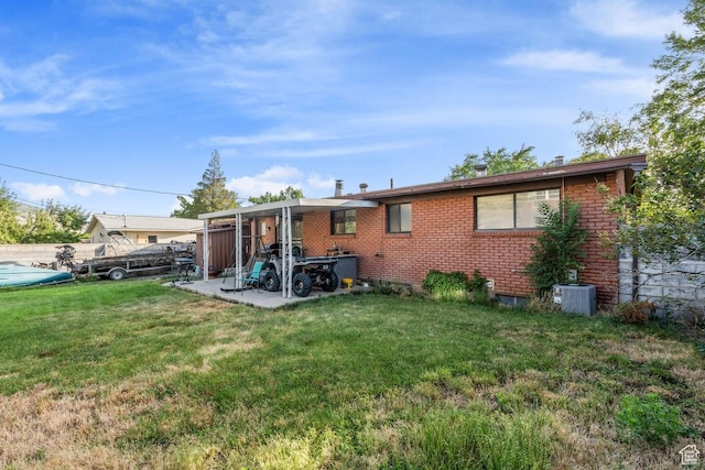 961 Hillview Rd, Brigham City, UT 84302 - back of property featuring brick siding and a yard