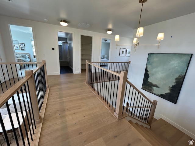 3868 N 475 E, North Ogden, UT 84414 - corridor with an upstairs landing, built in features, and wood finished floors