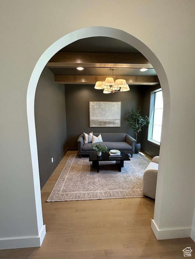 3868 N 475 E, North Ogden, UT 84414 - living area with arched walkways, wood finished floors, a chandelier, and recessed lighting