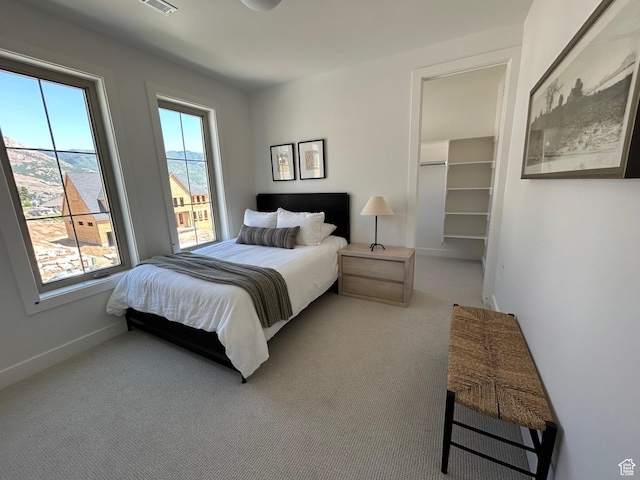 3868 N 475 E, North Ogden, UT 84414 - carpeted bedroom featuring baseboards and a walk in closet