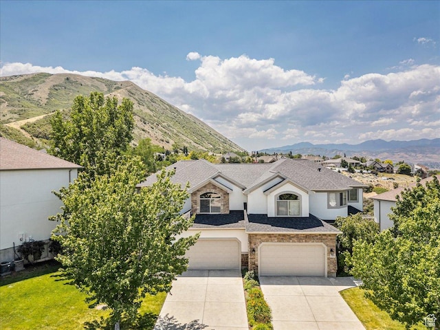 14618 S Gallatin Ln E, Draper, UT 84020 - view of front of property featuring a mountain view, driveway, a garage, and a shingled roof