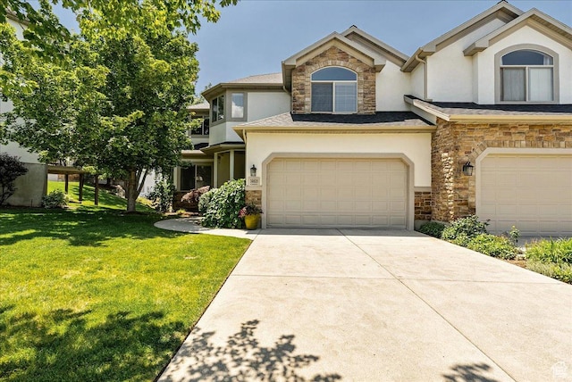 14618 S Gallatin Ln E, Draper, UT 84020 - view of front of property with stone siding, stucco siding, a front lawn, concrete driveway, and a garage
