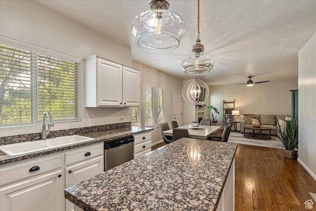 14618 S Gallatin Ln E, Draper, UT 84020 - kitchen with stainless steel dishwasher, a center island, ceiling fan, white cabinets, and dark wood-style flooring