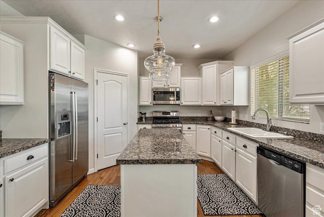 14618 S Gallatin Ln E, Draper, UT 84020 - kitchen with appliances with stainless steel finishes, white cabinetry, a center island, wood finished floors, and recessed lighting