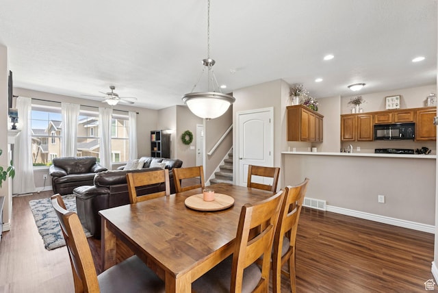 14616 S Auroral Way, Herriman, UT 84096 - dining space with dark wood-style flooring, recessed lighting, ceiling fan, and stairway