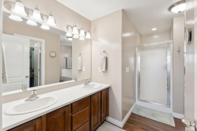 14616 S Auroral Way, Herriman, UT 84096 - full bathroom with a stall shower, double vanity, and wood finished floors