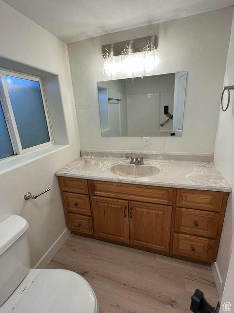 48 N Village Way, Washington, UT 84780 - bathroom with vanity and wood finished floors