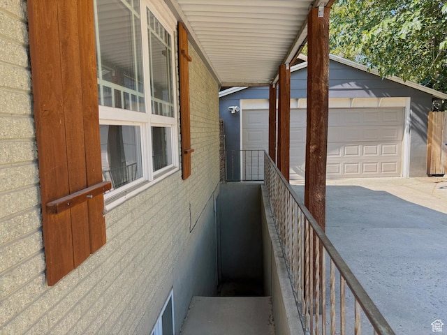 2057 E Castle Hill Ave, Cottonwood Heights, UT 84121 - view of side of home featuring brick siding, an outdoor structure, and a garage