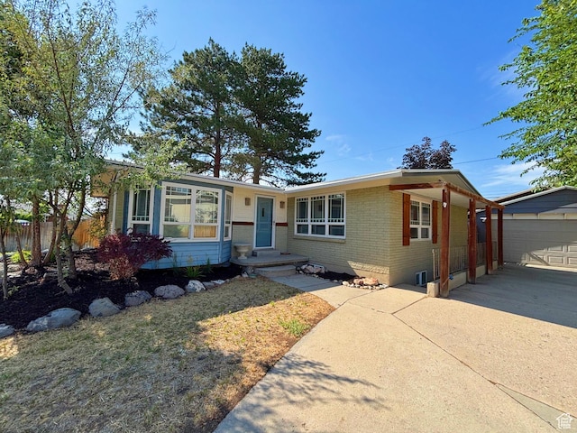 2057 E Castle Hill Ave, Cottonwood Heights, UT 84121 - ranch-style house featuring driveway, brick siding, and an outbuilding