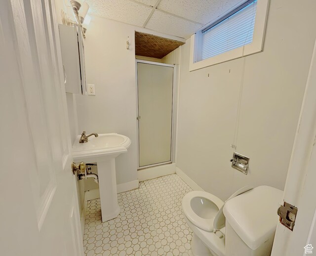 2057 E Castle Hill Ave, Cottonwood Heights, UT 84121 - bathroom with a shower stall, a drop ceiling, and tile patterned floors