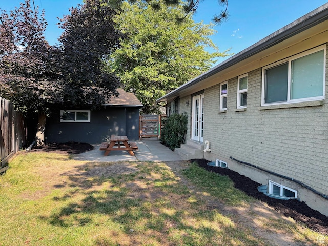 2057 E Castle Hill Ave, Cottonwood Heights, UT 84121 - fenced backyard featuring entry steps and a patio area
