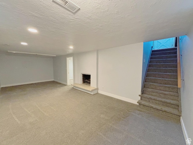 2057 E Castle Hill Ave, Cottonwood Heights, UT 84121 - finished below grade area with a fireplace with raised hearth, stairway, carpet flooring, recessed lighting, and a textured ceiling