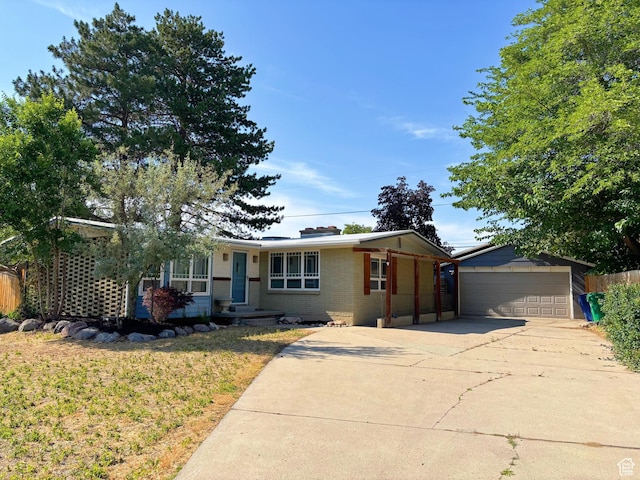 2057 E Castle Hill Ave, Cottonwood Heights, UT 84121 - ranch-style home featuring a garage, brick siding, and a front yard