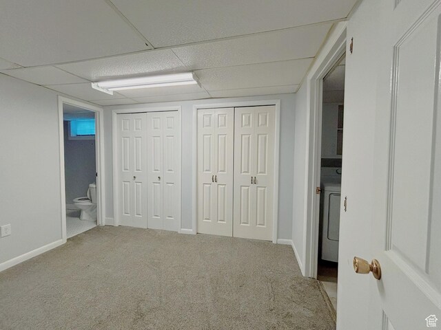 2057 E Castle Hill Ave, Cottonwood Heights, UT 84121 - unfurnished bedroom with multiple closets, carpet, washer / clothes dryer, ensuite bath, and a drop ceiling