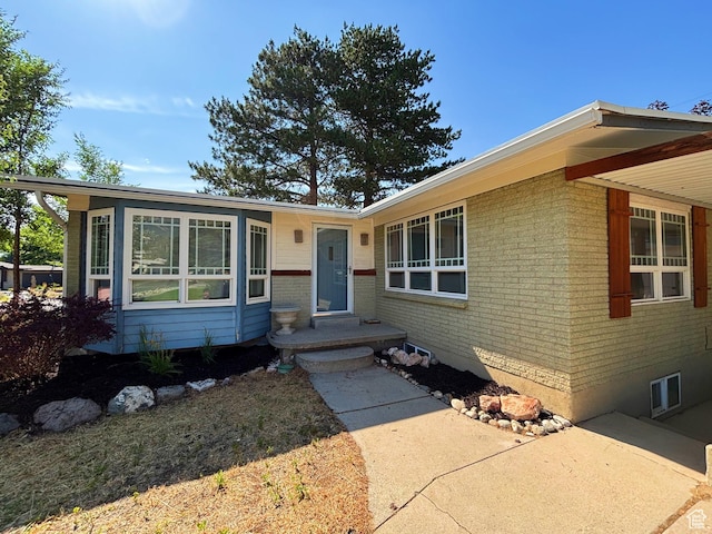2057 E Castle Hill Ave, Cottonwood Heights, UT 84121 - view of front of property featuring brick siding