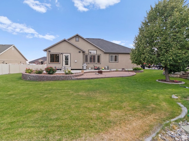 2618 W Mountain Rd, Tremonton, UT 84337 - back of property with a patio area and stucco siding