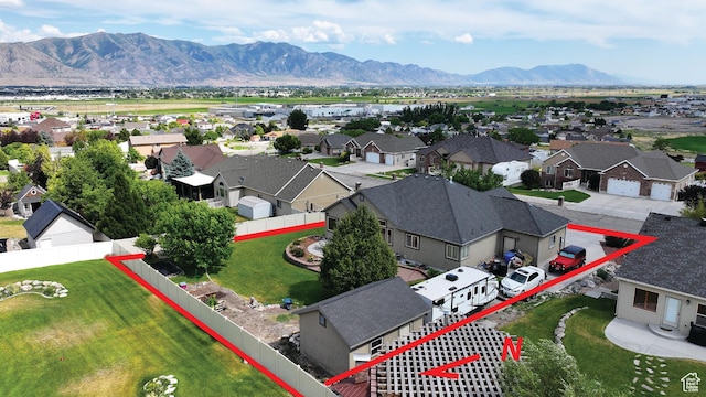 2618 W Mountain Rd, Tremonton, UT 84337 - aerial view of residential area with property boundaries highlighted and a mountain backdrop