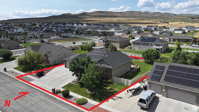 2618 W Mountain Rd, Tremonton, UT 84337 - aerial perspective of suburban area with a mountainous background and property boundaries highlighted
