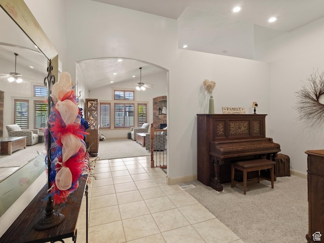 2618 W Mountain Rd, Tremonton, UT 84337 - hallway with light colored carpet, arched walkways, recessed lighting, lofted ceiling, and light tile patterned floors