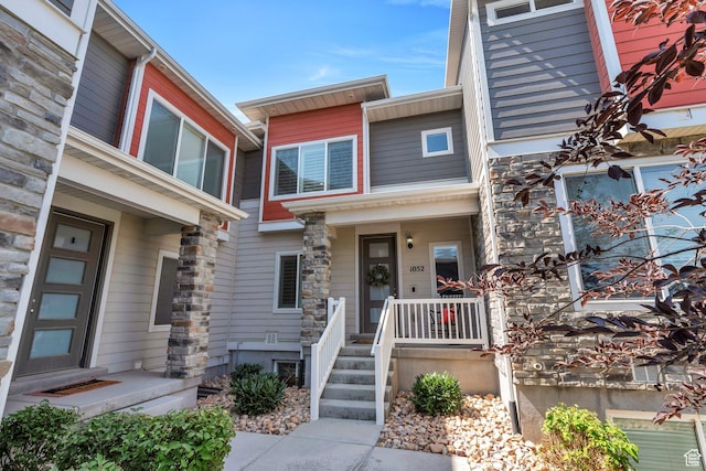 1052 W Azul Meadows Way S, Bluffdale, UT 84065 - view of front of home with stone siding and covered porch