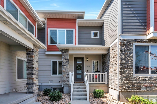1052 W Azul Meadows Way S, Bluffdale, UT 84065 - property entrance with stone siding and covered porch
