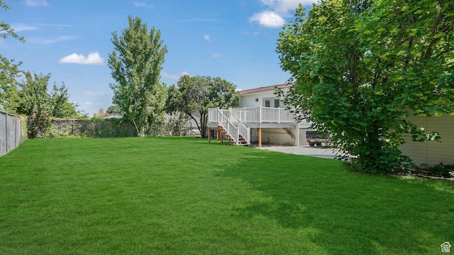 6568 S 5180 W, West Jordan, UT 84081 - fenced backyard featuring a wooden deck, stairway, and a patio area